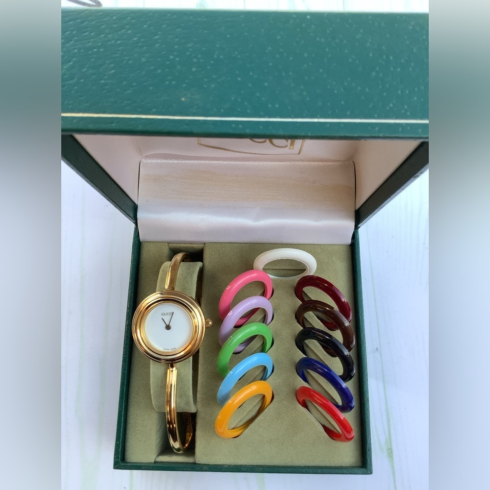 Gucci Gold Bangle Watch with Interchangeable Colorful Bezels